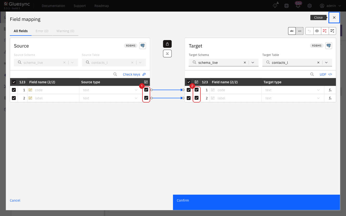 Field mapping with the Key column ticked for code and label on the source (1) and on the target (2)